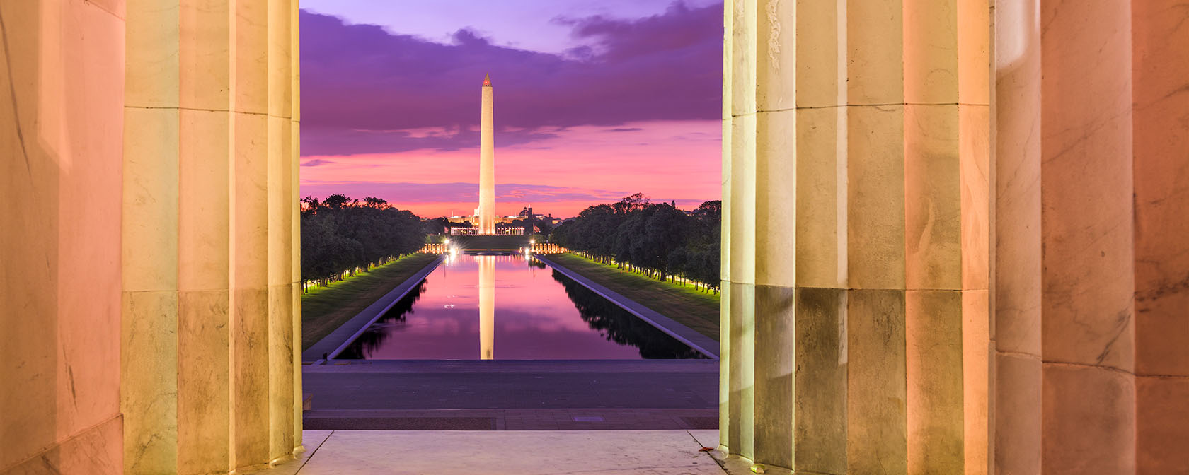 view of the Washington Monument and Reflecting Pool from the Lincoln Memorial with pretty sunset colors