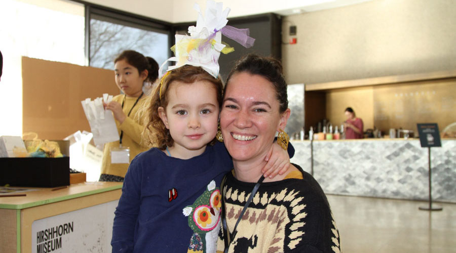 Family attending Art Cart: Tricky Tree Hats 