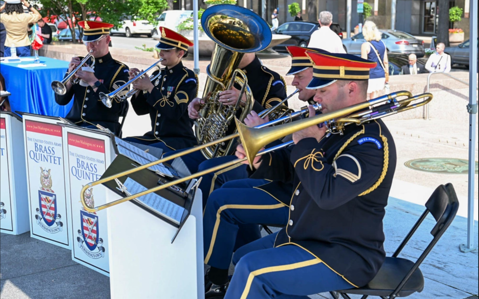 Members of the U.S. Army Brass Quintet perform in uniform during an outdoor concert in Washington, DC.