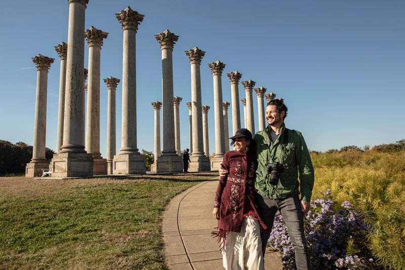 Couple walking by the National Capitol Columns at the National Arboretum - Public park and attraction in Washington, DC