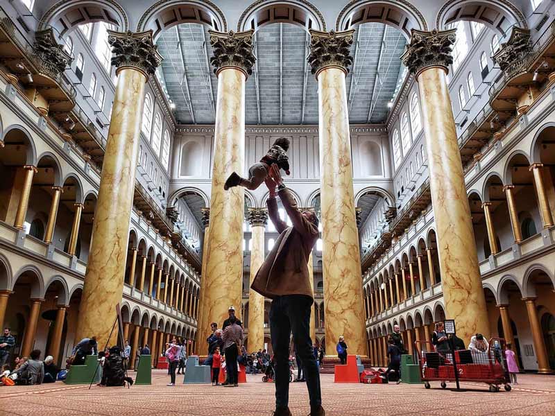 @travellercrazymom - Parent with child at the National Building Museum - Cool museums off the National Mall in Washington, DC