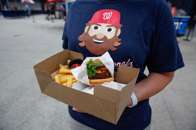 Washington Nationals fan with concessions at Nationals Park - The best places to eat at Nats Park in DC