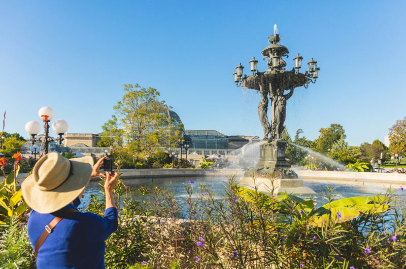 Woman taking photo at Bartholdi Fountain on Capitol Hill - Parks in Washington, DC