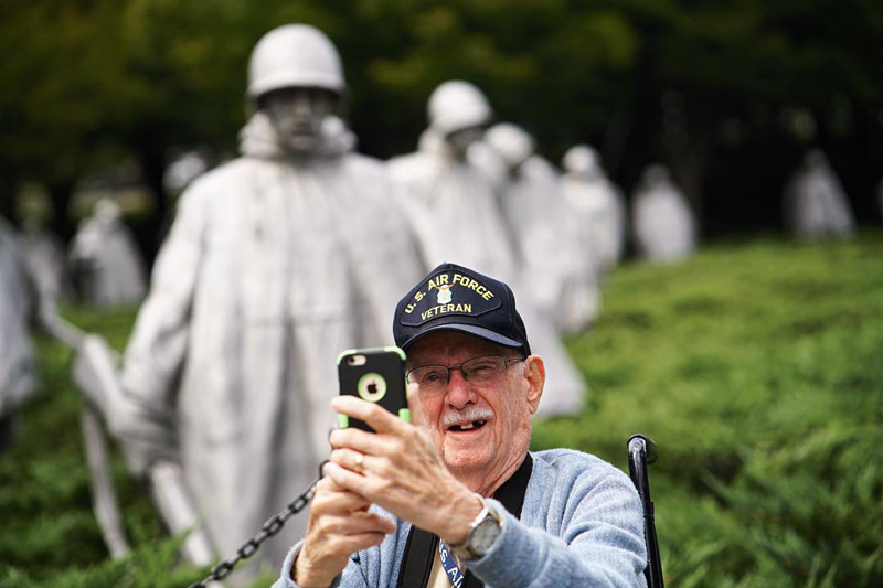 @mikijourdan - U.S. veteran on Honor Flight taking selfie in front of Korean War Veterans Memorial - The National Mall in Washington, DC @mikijourdan - U.S. veteran on Honor Flight taking selfie in front of Korean War Veterans Memorial - The National Mall in Washington, DC