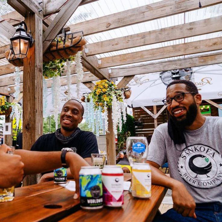 Local brewers from Sankofa Beer Company drinking beer at Midlands