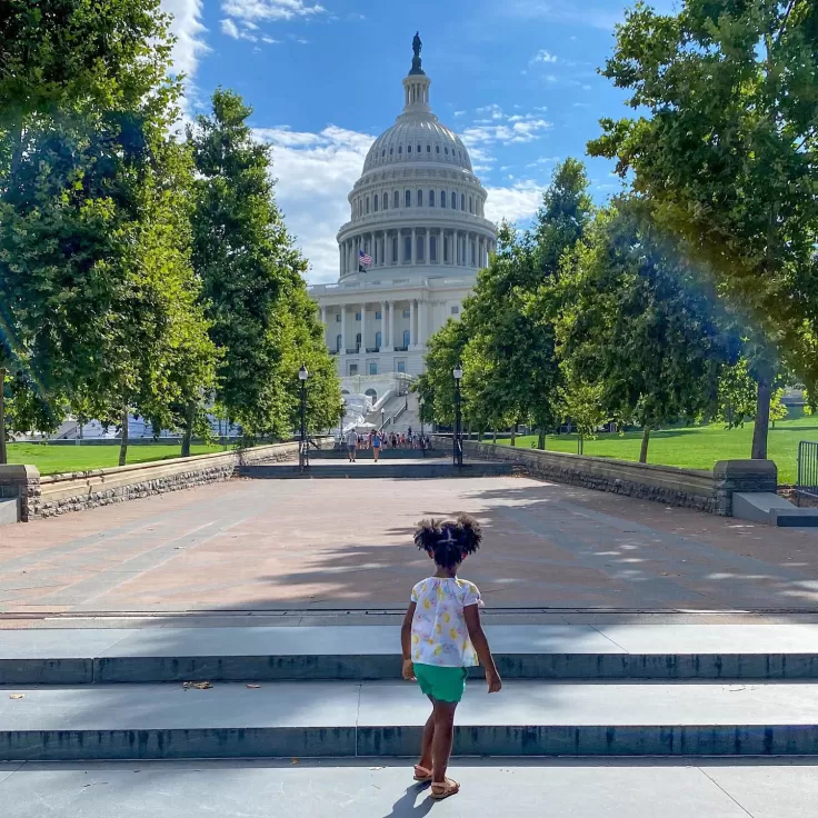 Little one looking up at US Capitol