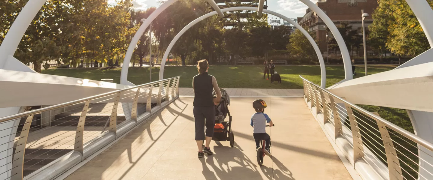 Family crossing the Capitol Riverfront Bridge