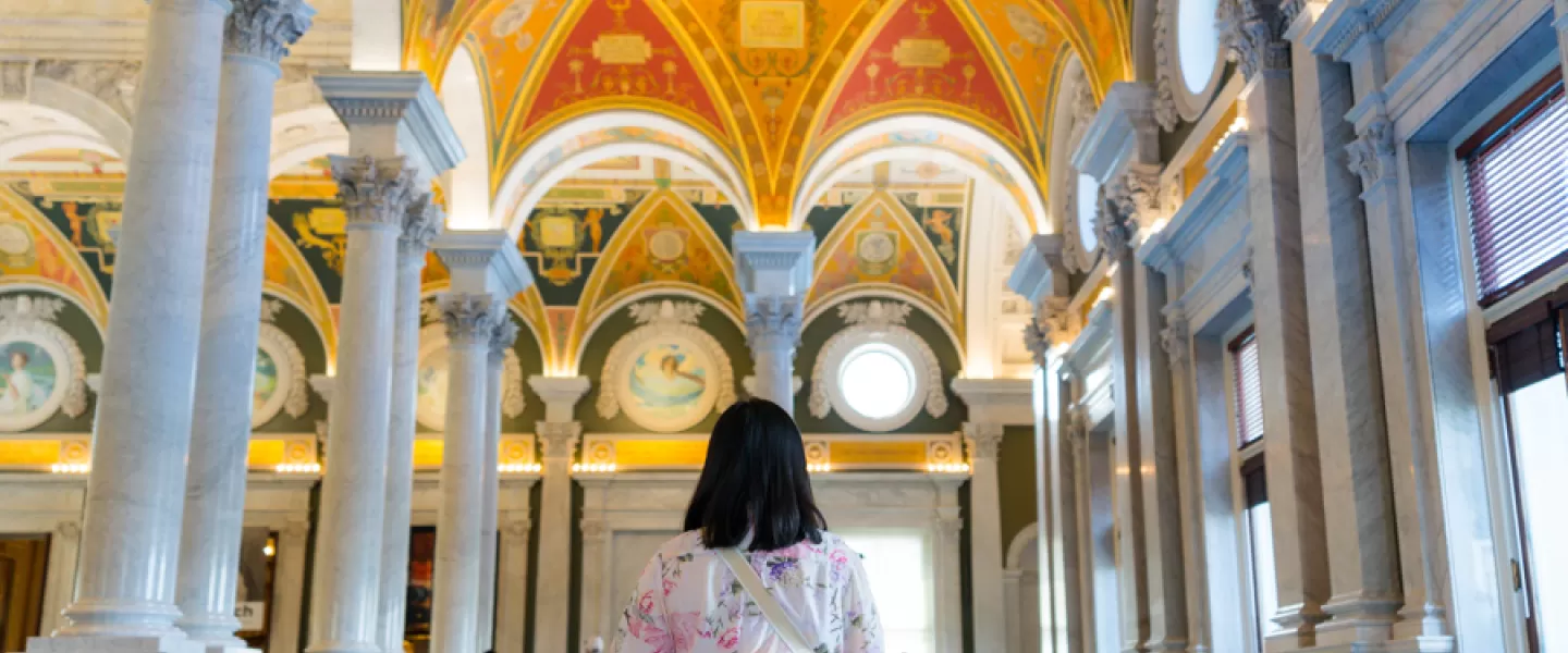 Person standing inside the Library Of Congress