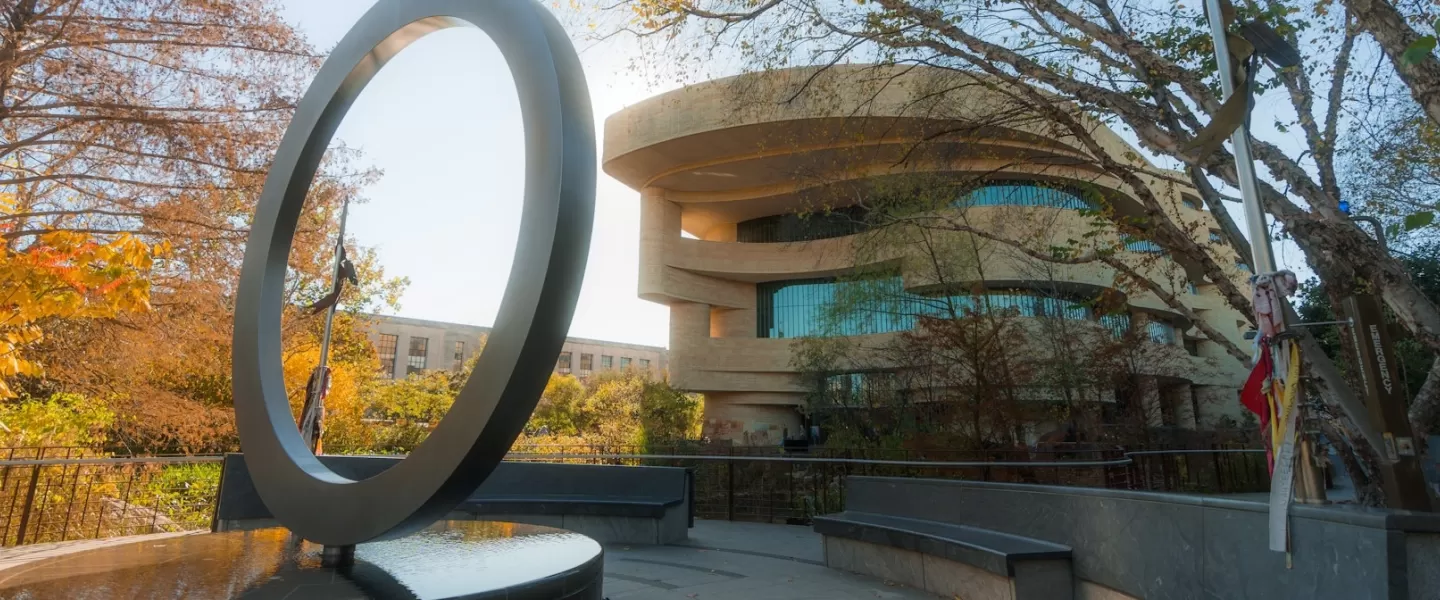 The National Native American Memorial with the National Museum of the American Indian behind