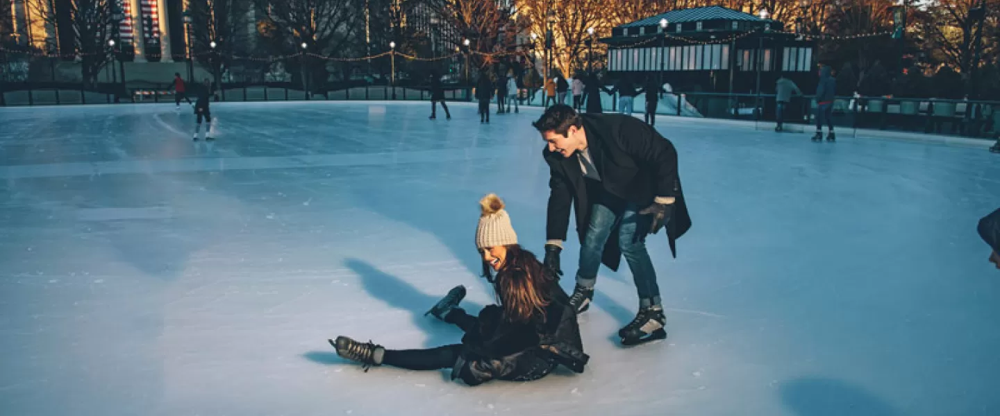 Couple ice skating at the National Gallery of Art Sculpture Garden on the National Mall in Washington, DC