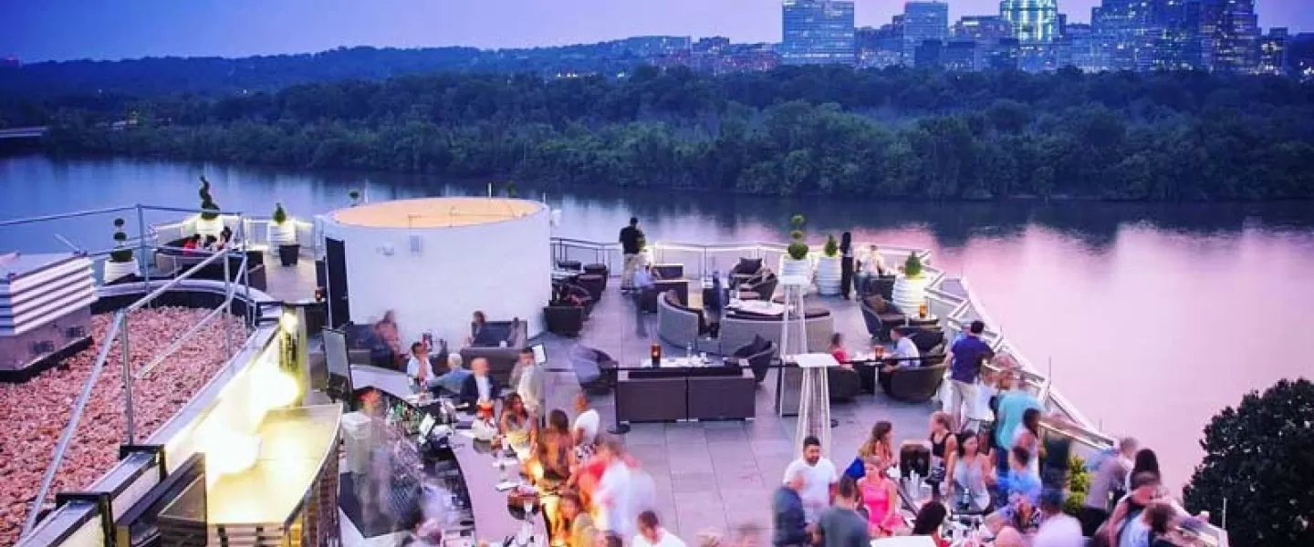 @watergatehotel - Top of the Gate rooftop bar at The Watergate Hotel - Sunset overlooking Potomac River in Washington, DC