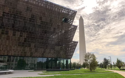 National Museum of African American History and Culture on the National Mall with Washington Monument

