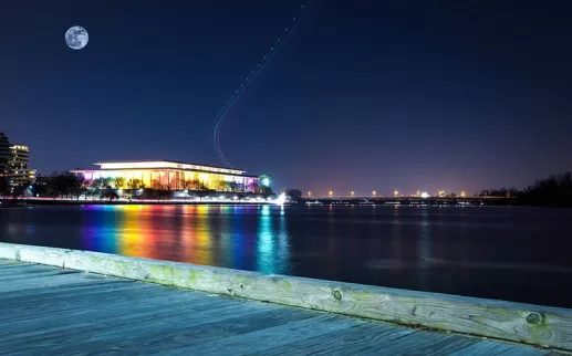 The John F Kennedy Center lit up with rainbow lights
