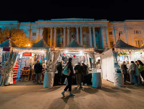 Downtown Holiday Market tents at night