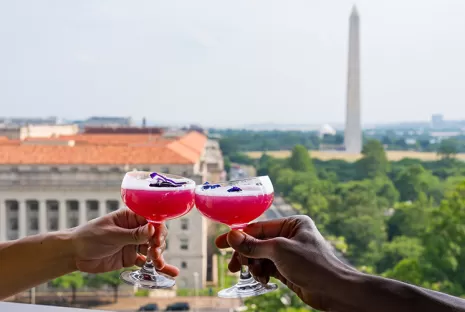 Drinks clinking on VUE Rooftop 